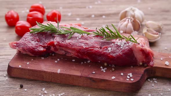 Cooking Concept. Raw Beef Steak on a Wooden Table