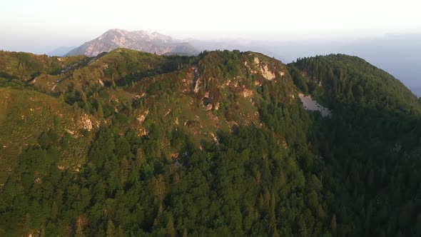 Flying over the hills and mountains at sunrise