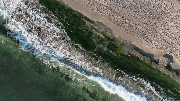 Texture of the rocky beach aerial view 4 K Turkey Alanya