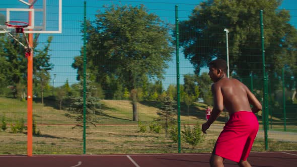 Streetball Player Making Bouncing Pass To Teammate