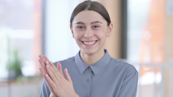 Portrait of Young Latin Woman Clapping Appreciating
