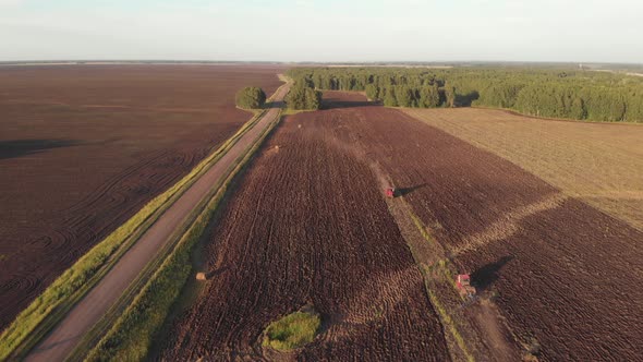 Tractors Ploughing Fields