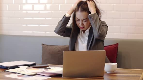 Women in the office have stress and pressure on their jobs.