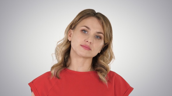 Young Woman Red T-Shirt Is Walking Looking at Camera On