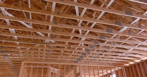 Construction of a Wooden Building Showing Wood Beam Framework with Wooden Truss Rafters