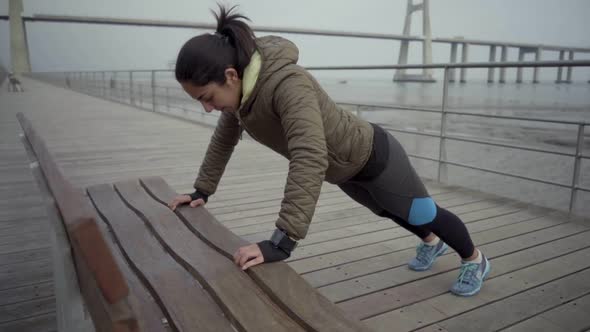 Thoughtful Brunette Sportswoman During Outdoor Workout