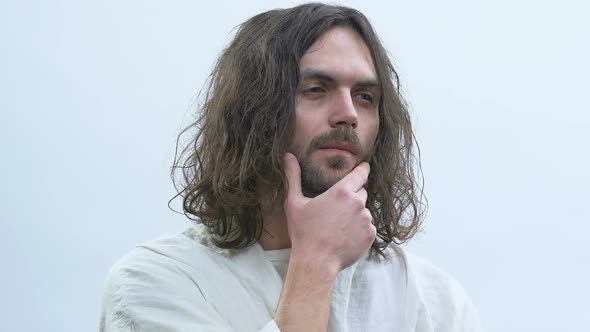 Jesus Touching Chin Against White Background, Thinking About Saving Sinners