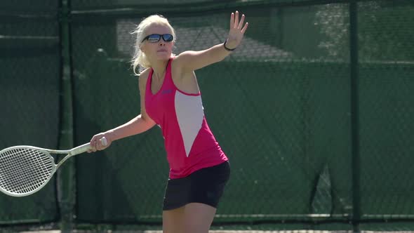 Women playing tennis.