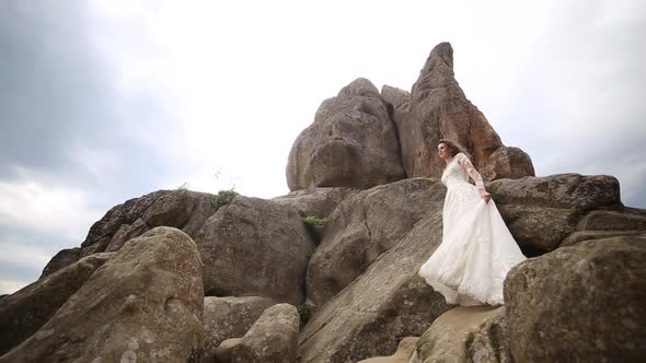 Beautiful Bride in Fashion Wedding Dress on Natural Background