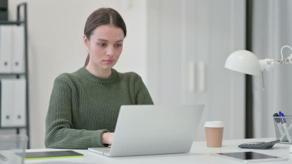 Young Woman Working on Laptop 