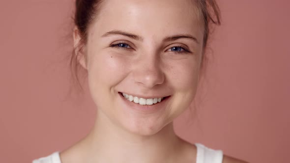 Close up portrait of fully smiling caucasian teenage woman. Shot with RED helium camera in 8K.