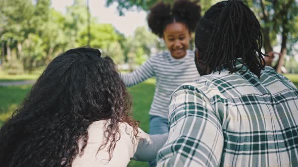 Have Fun Together in the Summer Park Happy Family Weekend