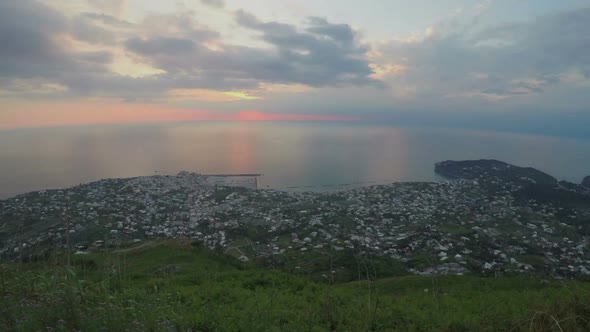 Sea Sunset Timelapse, Unforgettable View on City Located in Mountains, Tourism