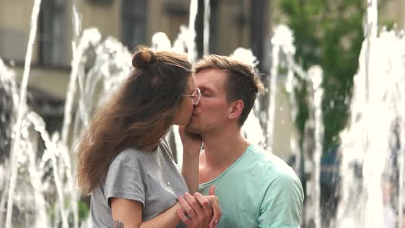 Young Couple in Love Kissing Outdoors