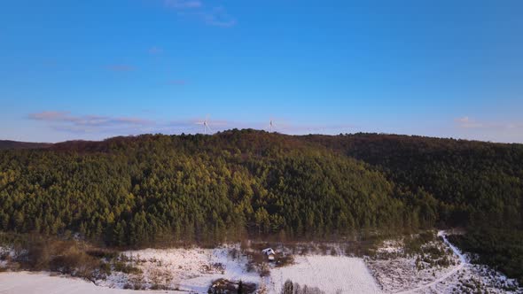 Aerial Drone View Wind Power Turbine on the Horizon Green Energy Concept