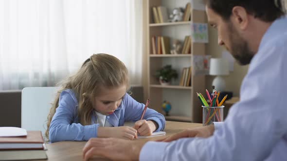 Strict Dad Talking to Daughter Doing Homework, Parental Control, Education