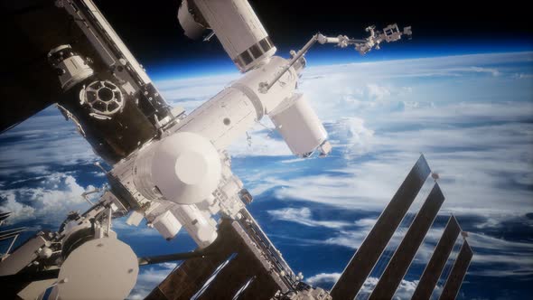 International Space Station in Outer Space Over the Planet Earth alt