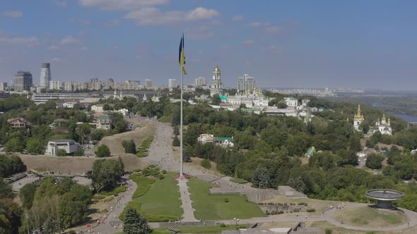 Aerial View of The Largest Flag of Ukraine is Flying Against the Backdrop of the City of Kyiv