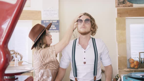 Stylist woman preparing male model