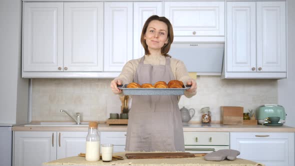 Beautiful Young Woman Baking Pastry In Kitchen