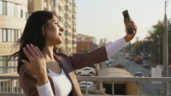 Beautiful Brunette Businesswoman In Business Clothes Walks In The City