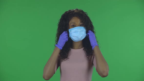 Portrait of Beautiful African American Young Woman Which Is Removes Medical Protective Mask Breathes
