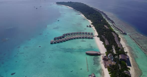 Wide angle birds eye copy space shot of a paradise sunny white sand beach and turquoise sea backgrou