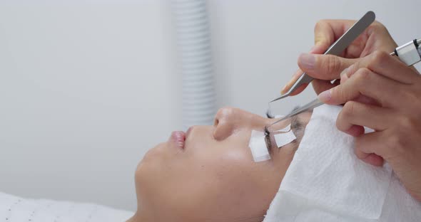 Procedure of eyelashes extension in salon