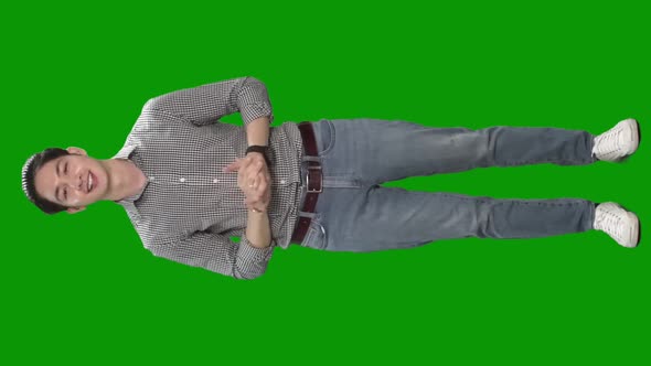 man talking to camera on green screen