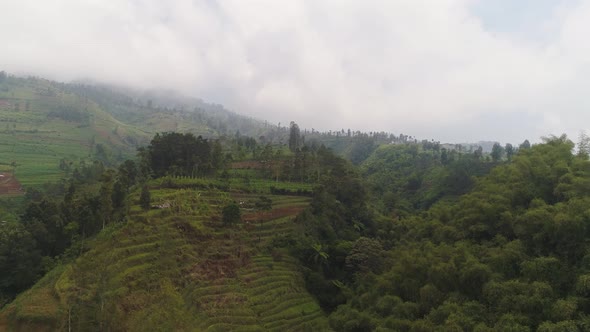 Tropical Landscape with Farmers Lands in the Mountains