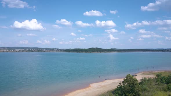 Aerial shots of a lake park in Texas on the popular Canyon Lake while barely any boats are cruising