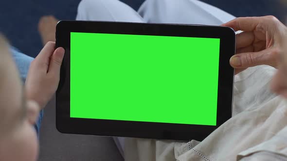 Granddaughter Showing Granny Mobile Apps on Green Screen Tablet, Messenger