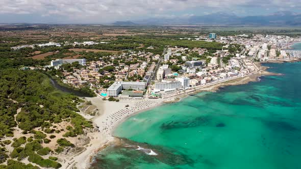 Aerial drone footage of the beach front on the Spanish island of Majorca Mallorca, Spain