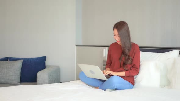 Young asian woman use laptop