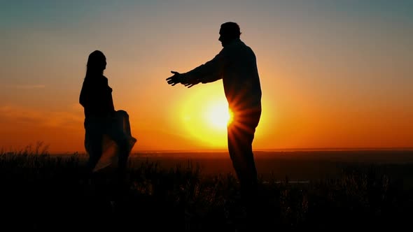 Silhouette Happy Couple at Dawn