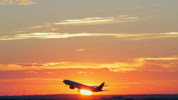 Plane Taking Off at Golden Sunset