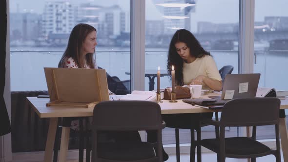 University Students Studying At Table