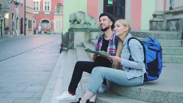 Tourists Checking City Map and Discussing