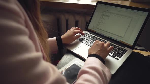 Beautiful Young Freelancer Woman Using Laptop Computer Sitting At Cafe Table. Businesswoman Hand