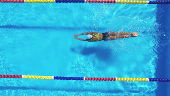 Woman Is Swimming in Pool During Triathlon Training