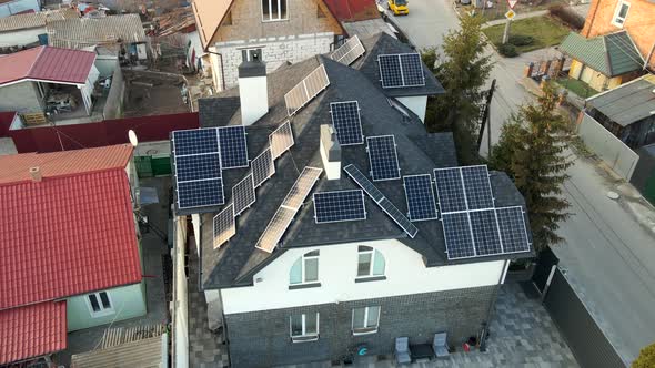 Aerial View of Photovoltaic Solar Panels on the Roof of a Building for Renewable Energy