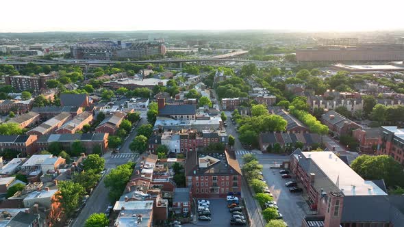 American city in USA. Aerial truck shot of neighborhood community during warm summer sunlight.