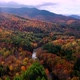 Aerial flythrough of Winding Road Through Autumn Trees with Fall Colors in New England - VideoHive Item for Sale