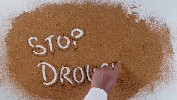 Hand Writes On Soil  Stop Drought