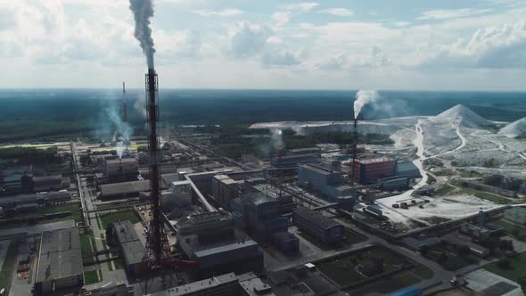 Mining and Processing Plant, View of Pipes and Smoke, Mineral Piles, Mountains of Minerlas and Sand