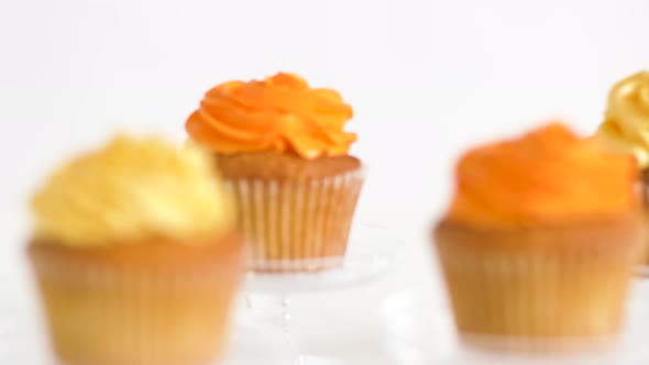 Cupcakes with Frosting on Confectionery Stands