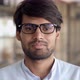 Headshot of Young Indian Businessman Wears Glasses Looks at Camera in Office - VideoHive Item for Sale