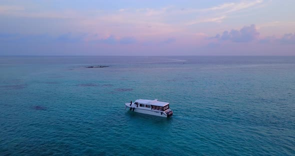 Natural aerial tourism shot of a sandy white paradise beach and blue sea background in best quality 