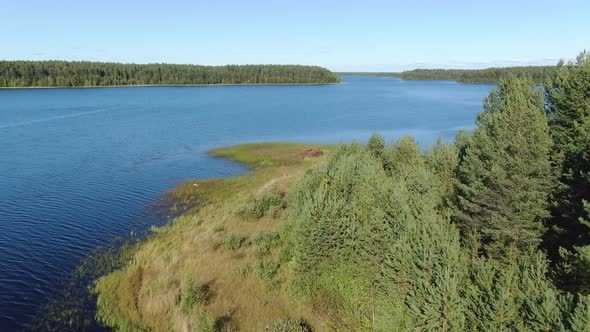 Flight Over the Taiga Forest Lake