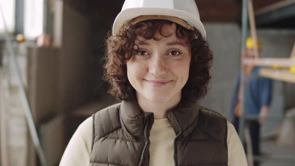 Portrait of Cheerful Female Architect at Construction Site